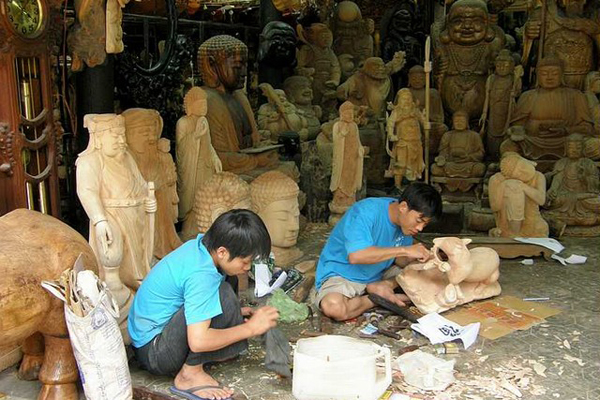 Artisans Decorating the wooden products at Kim Bong Carpentry Village