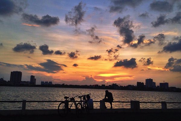 sunset at west lake in hanoi