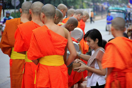 Alms giving in Laos