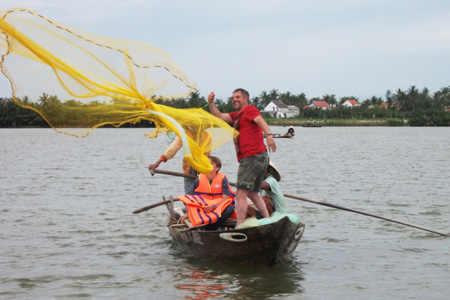 Casting fishing net from rounded bamboo boat