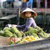 Fruit seller in Cai Be Floating Market of mekong delta