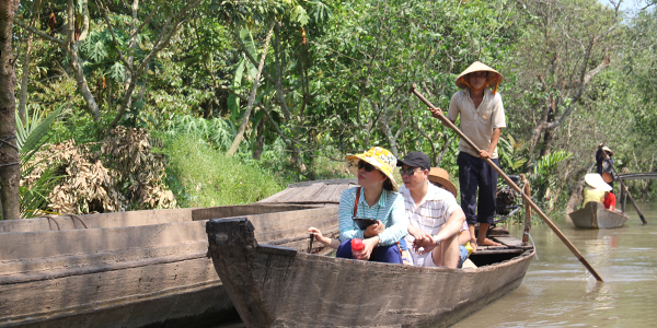 Take a sampan ride through waterways of Mekong Delta