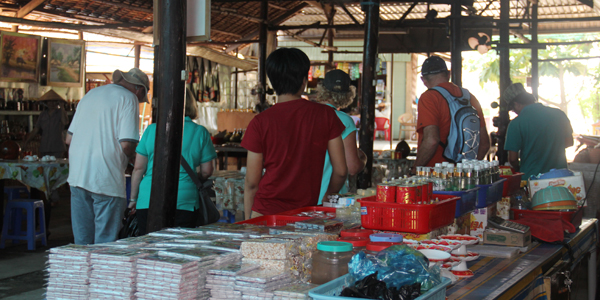 Visitors at a local coconut candy workshop in Mekong Delta