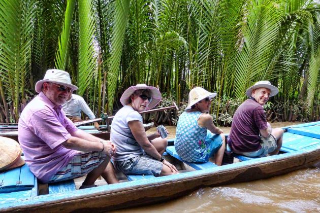 boat trip in small canals in mekong delta