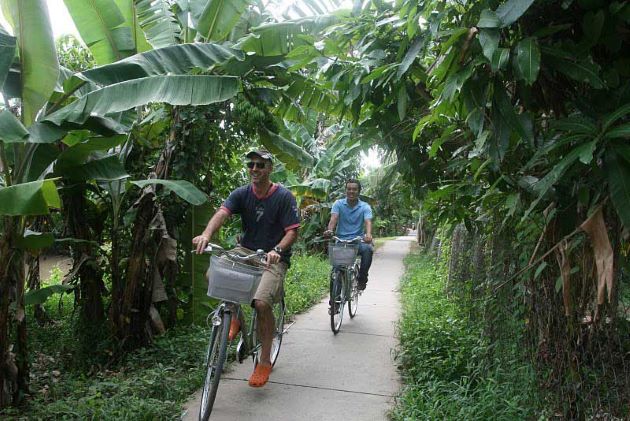 cycling trip in local village in mekong delta