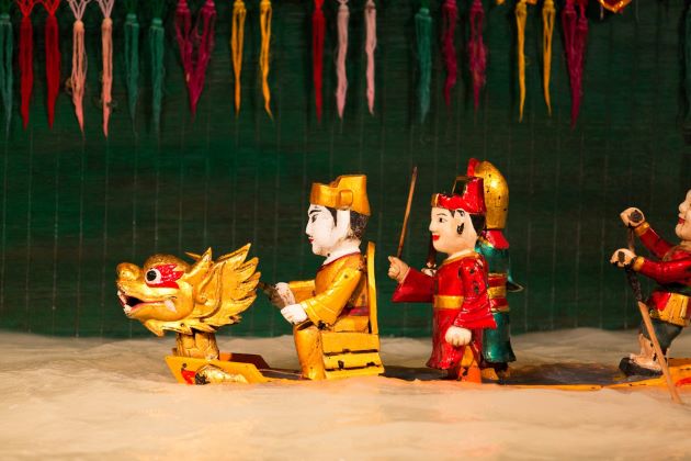 enjoy water puppet show in hanoi honeymoon