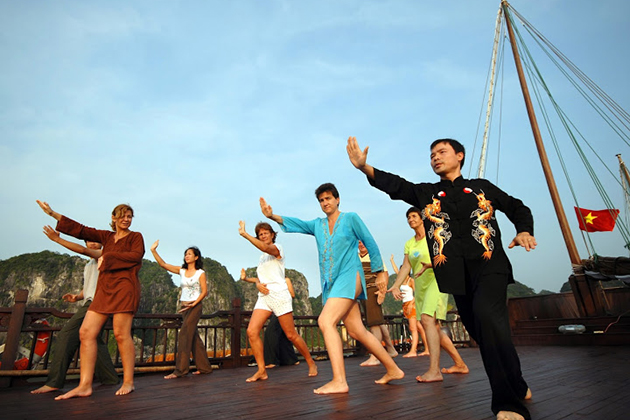 halong bay tai chi exercise in the morning