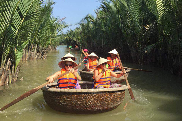 hoi an basketball bamboo boat along palm waterway