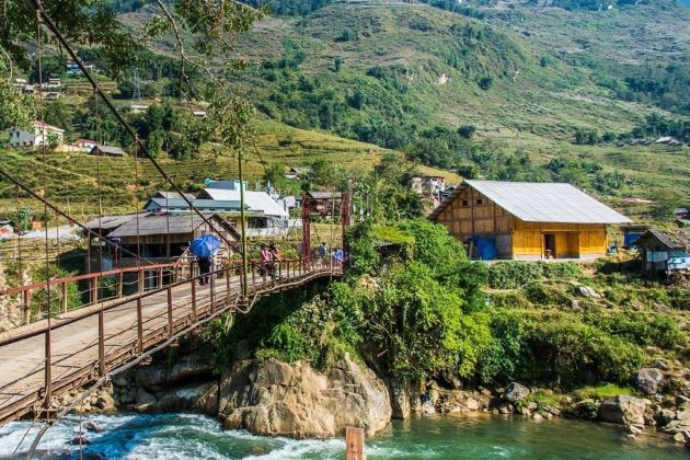 the bridge leads to a sapa local village