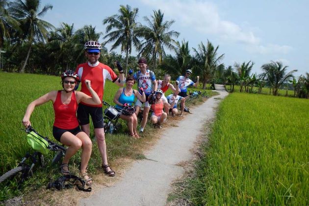 visit rice field in mekong delta by bike