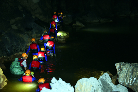 Swimming underground river in Dark cave