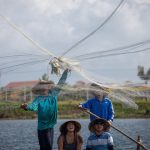 See the local cast fishing net on boat, Hoi An