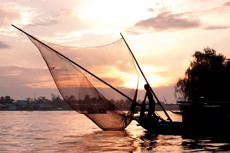 Fishing boat Mekong river Sunset