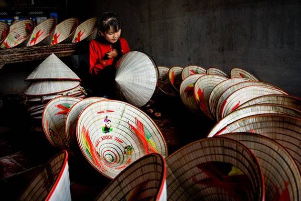 a craft village making conical hat