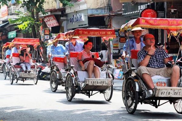 join in cyclo tour around Hanoi Old Quarter