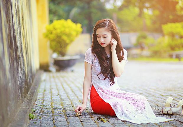 The woman in ao dai - the traditional costume of Vietnam