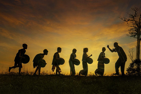 Old man training his students playing Gong - Central Highlands