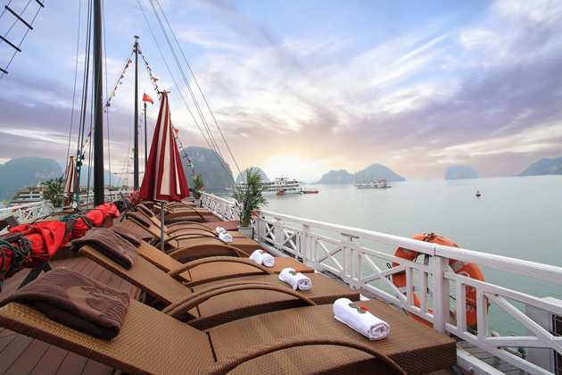 See sun rise over Bai Tu Long Bay on the sundeck