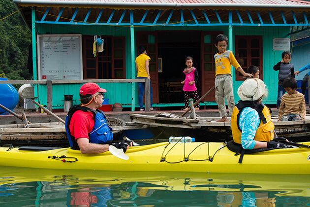 visit floating market in halong bay family tour