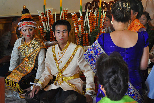 The bride and groom during their baci ceremony at lao wedding ceremony