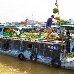 vibrant floating market in mekong delta