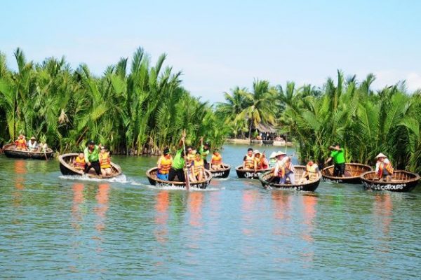 sit on basket boat in hoi an - Vietnam adventure tours