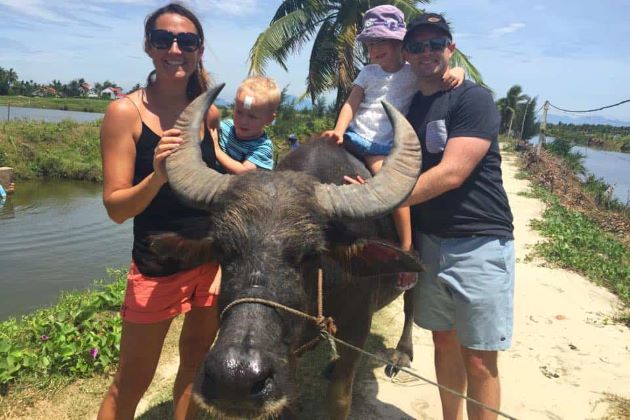 riding a buffalo in hoi an vietnam family holiday packages