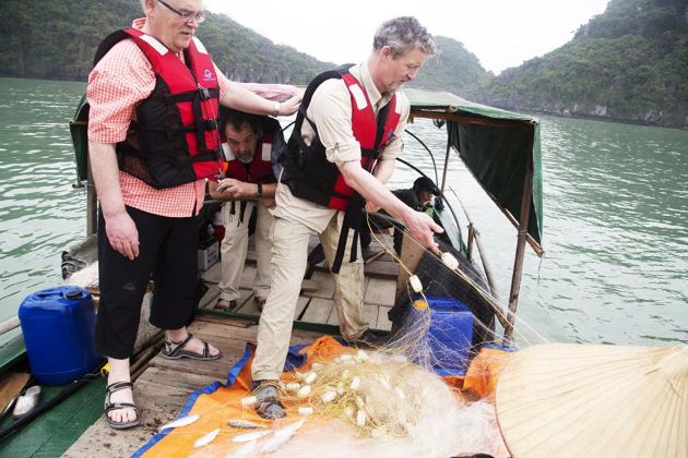 visit a fishing village in halong bay