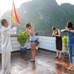 practice tai chi exercise in halong bay
