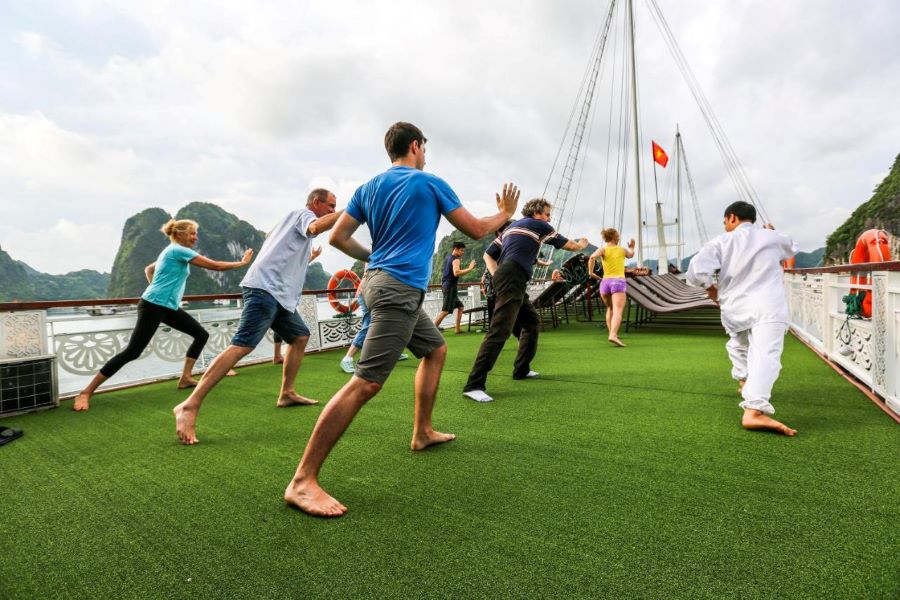 tai chi lesson in early morning in halong bay