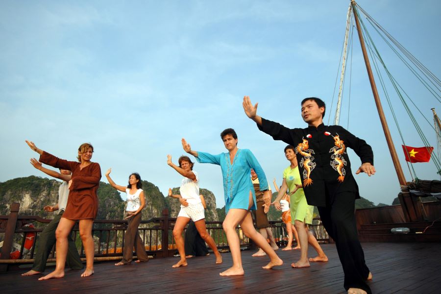 tai chi lesson in the morning at halong bay