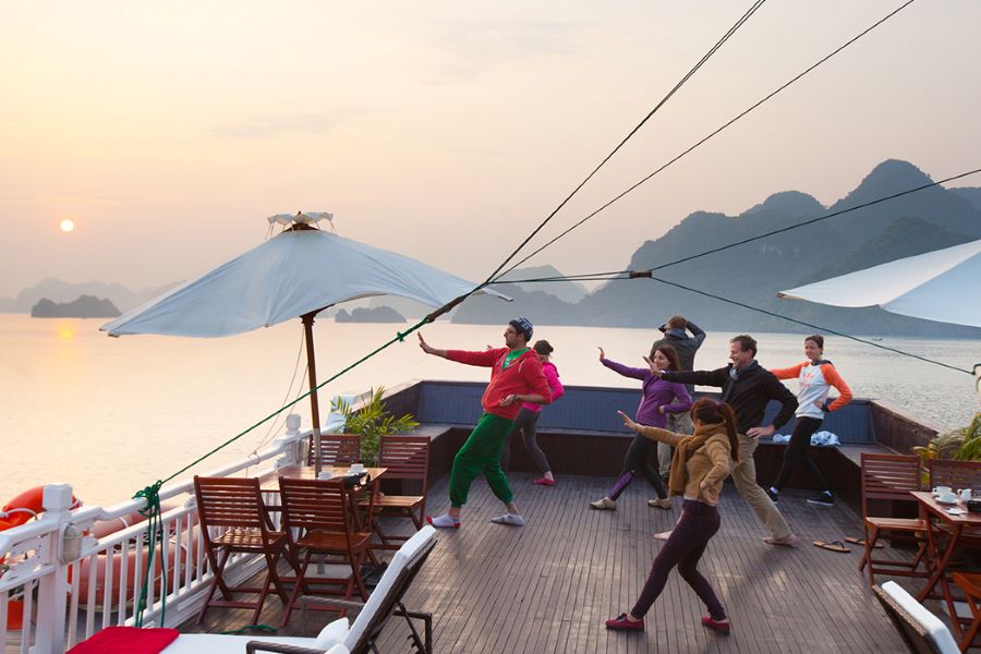 taichi class at dawn in halong bay