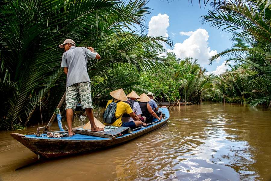 Rowing through Mekong Delta - Vietnam vacation package