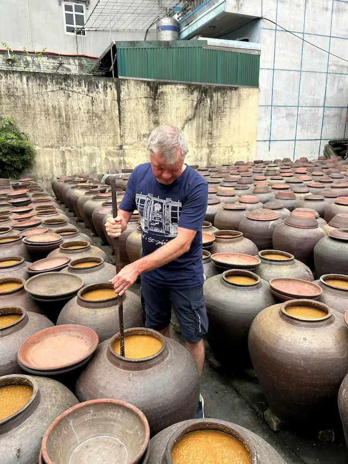 guest tried local experience at thu sy village during vietnam vacation packages